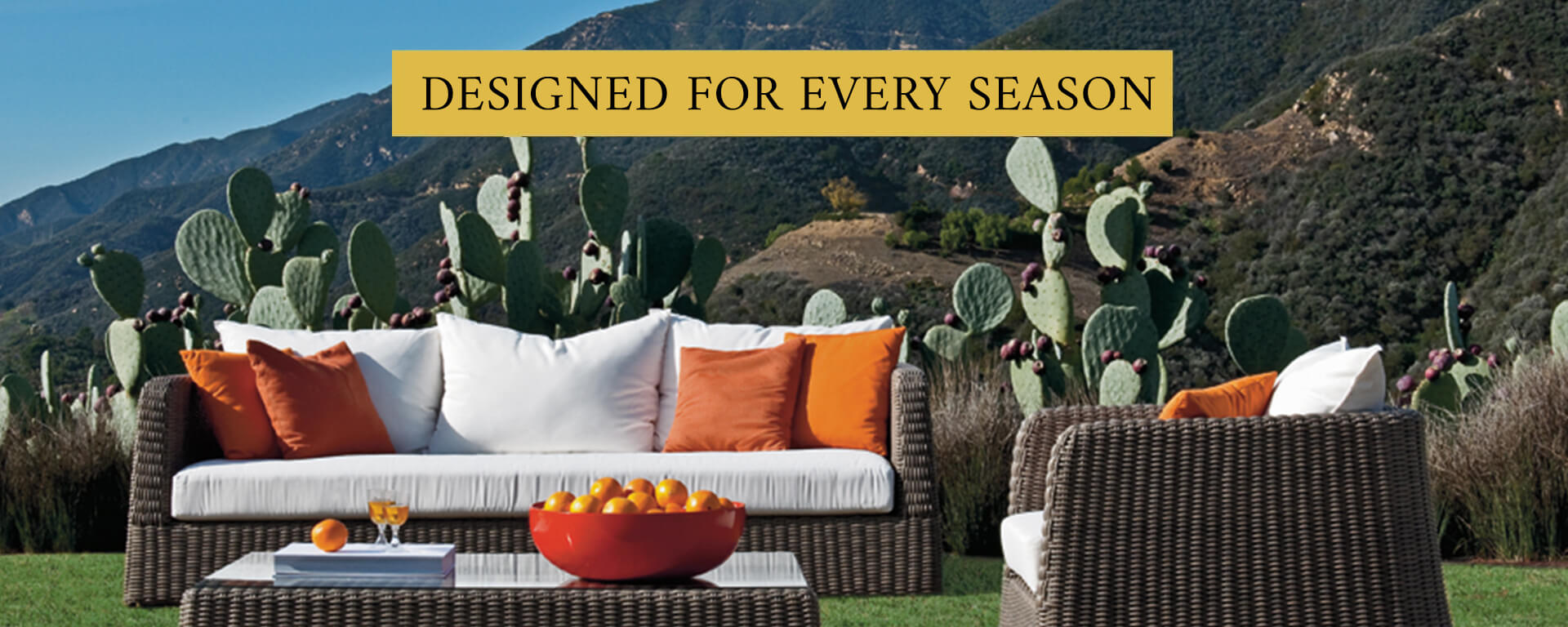 Loom Crafts Outdoor Garden Furniture A sailboat glides on a lake with mountains in the background, near an empty lounge area on a dock with modern furniture, under a clear blue sky.