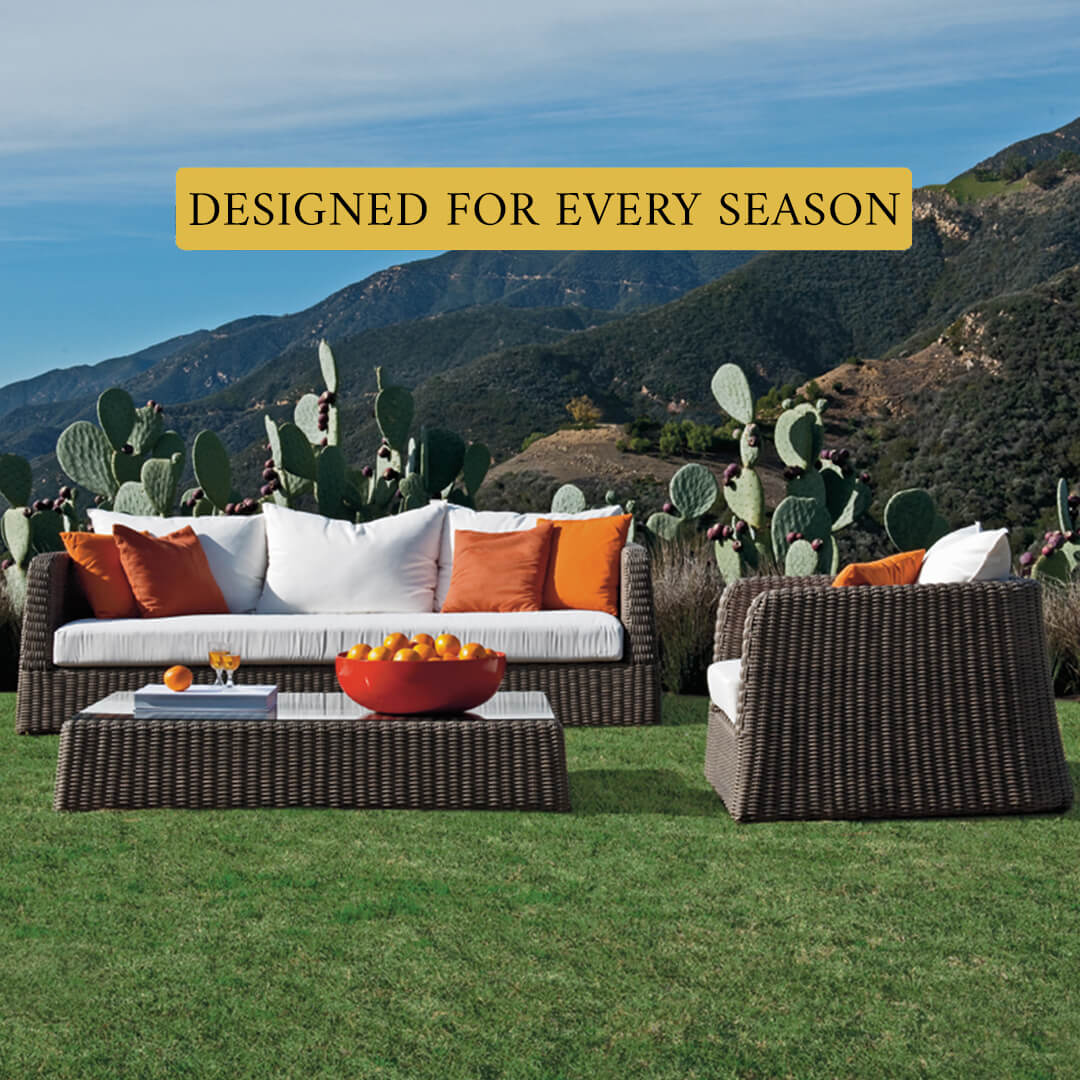 Loom Crafts Outdoor Garden Furniture A modern outdoor daybed with wicker detailing is positioned near the ocean shore on a wooden deck, accompanied by text overlay stating "LIFE TIME WARRANTY".