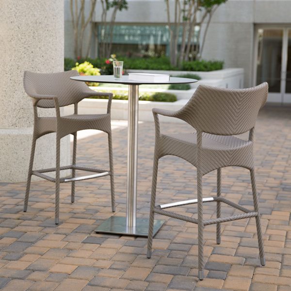 Loom Crafts Outdoor Garden Furniture A table and BAR STOOL WITH ARMS WITH CUSHION (LCO/001/006) on a brick walkway.