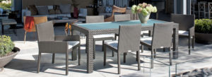 Loom Crafts Outdoor Garden Furniture An outdoor dining table with chairs and a potted plant.