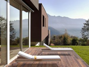 Loom Crafts Outdoor Garden Furniture A wooden deck with a view of mountains.