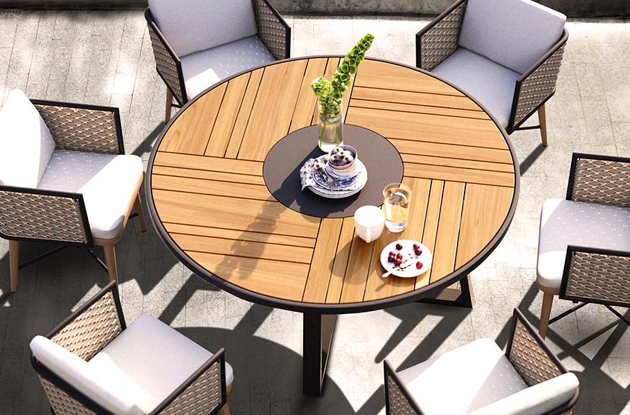 Loom Crafts Outdoor Garden Furniture A round outdoor dining table and chairs on a patio.