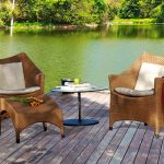 Loom Crafts Outdoor Garden Furniture A wooden deck with a table and chairs.