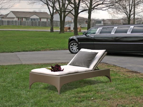 Loom Crafts Outdoor Garden Furniture A chaise lounge next to a limo.