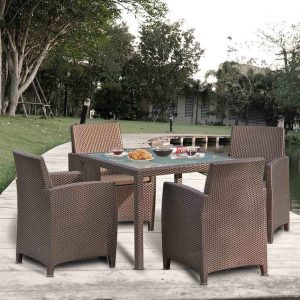 Loom Crafts Outdoor Garden Furniture A wicker dining set on a wooden deck.