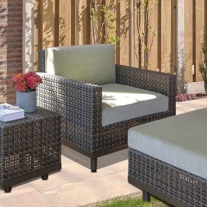 Loom Crafts Outdoor Garden Furniture A wicker patio furniture set on a patio.