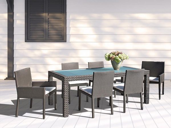 Loom Crafts Outdoor Garden Furniture An outdoor dining table with chairs and a glass top.
