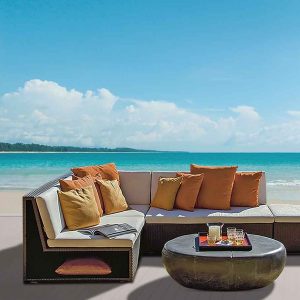Loom Crafts Outdoor Garden Furniture A sectional sofa set on the beach with a coffee table.