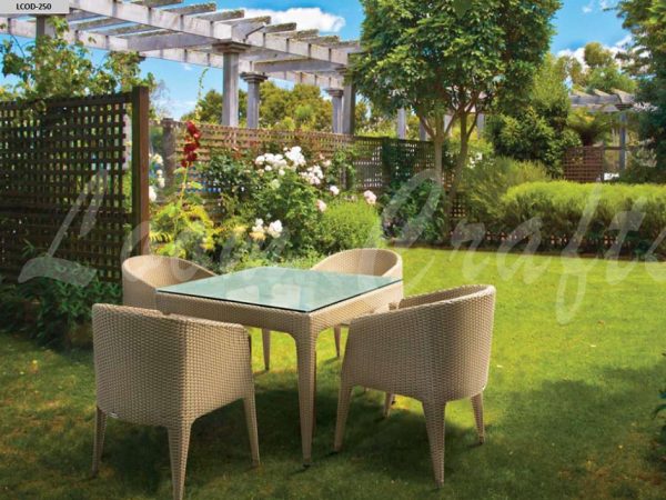 Loom Crafts Outdoor Garden Furniture A garden with a DINING TABLE WITH GLASS TOP (LCOD/250/002) and chairs.