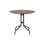 Loom Crafts Outdoor Garden Furniture A round OUTDOOR DINING TABLE WITH HPL TOP (LCO/077/002) with black legs and a wooden top.