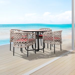 Loom Crafts Outdoor Garden Furniture A DINING ARMCHAIR LCO/086/001 on a deck overlooking the ocean.