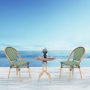 Loom Crafts Outdoor Garden Furniture Two TIFFANY LCCH.004.005 chairs and a table on a wooden deck with a view of the ocean.