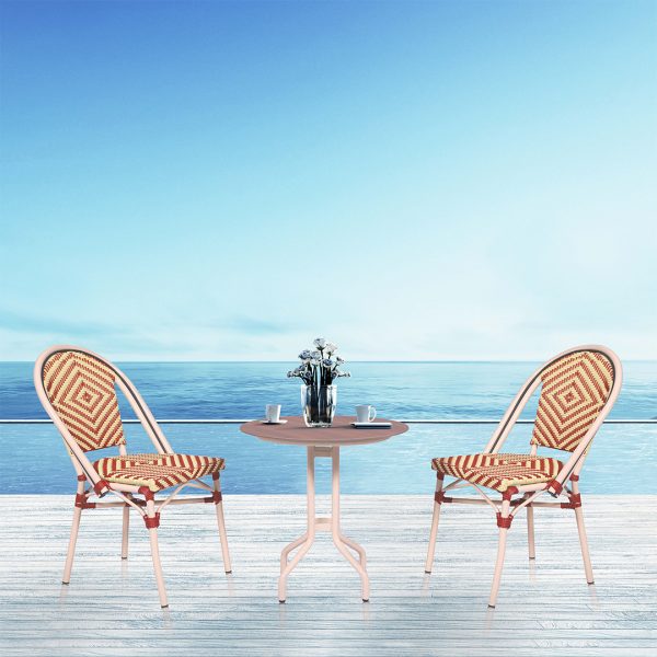 Loom Crafts Outdoor Garden Furniture Two AUDREY LCCH.005.004 and a table on a deck overlooking the ocean.