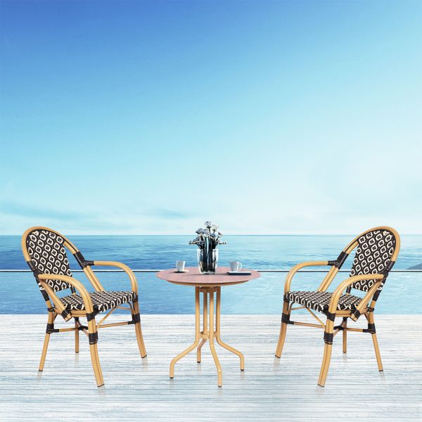 Loom Crafts Outdoor Garden Furniture Two MARILYN LCCH.006.005 chairs and a MARILYN LCCH.006.005 table on a wooden deck with a view of the ocean.