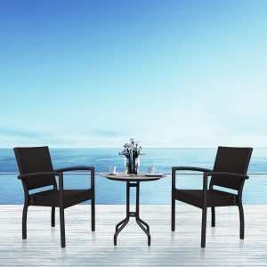 Loom Crafts Outdoor Garden Furniture Two ASPIRE LCCH.011.001 chairs and a table on a deck with a view of the ocean.