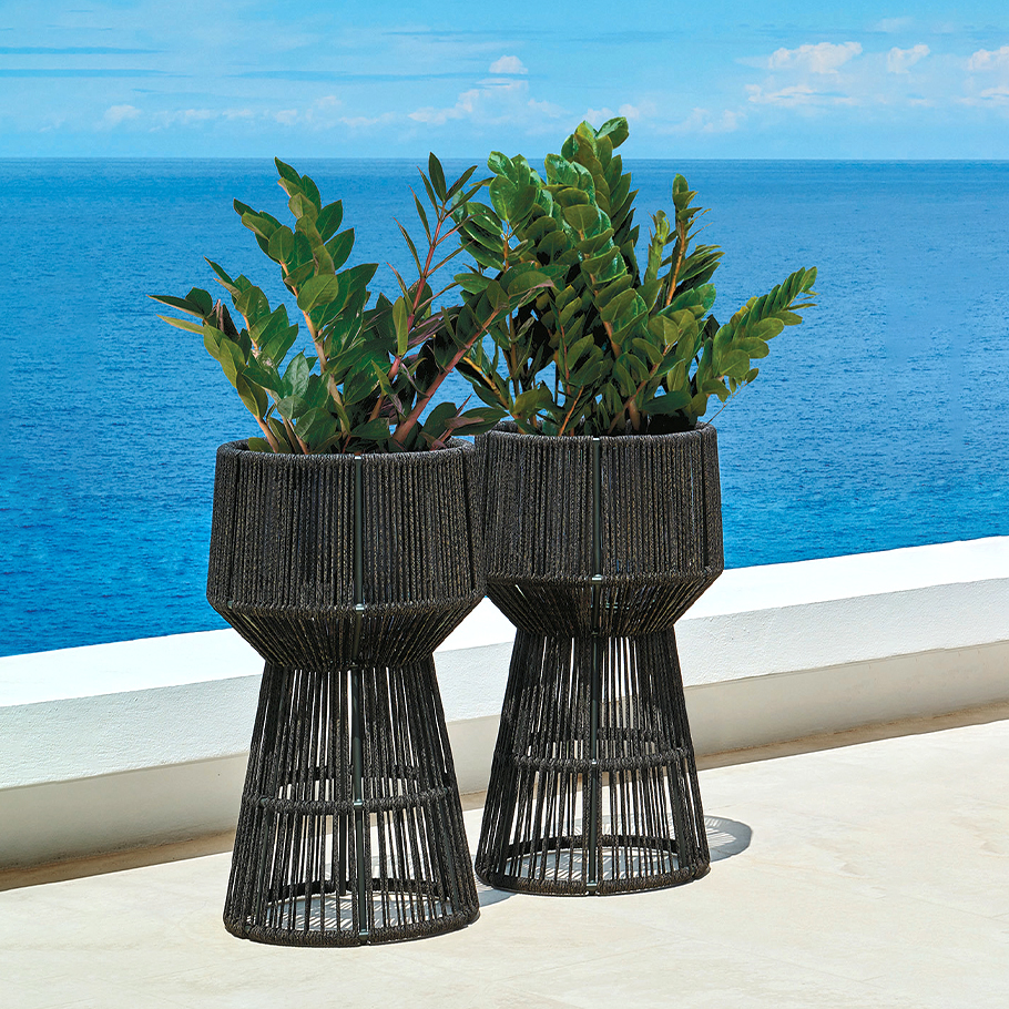 Loom Crafts Outdoor Garden Furniture Two wicker planters on a patio.