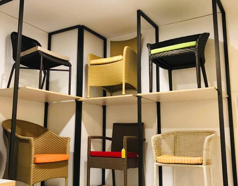 Loom Crafts Outdoor Garden Furniture A group of chairs on shelves in a room.