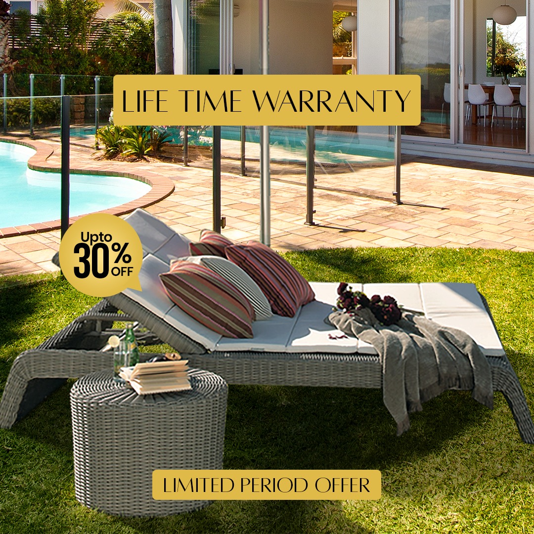 Loom Crafts Outdoor Garden Furniture A woman sits on an outdoor couch with cushions, holding a drink. The background features lush greenery. The text reads, "Sit, Relax, and Indulge in Luxury.