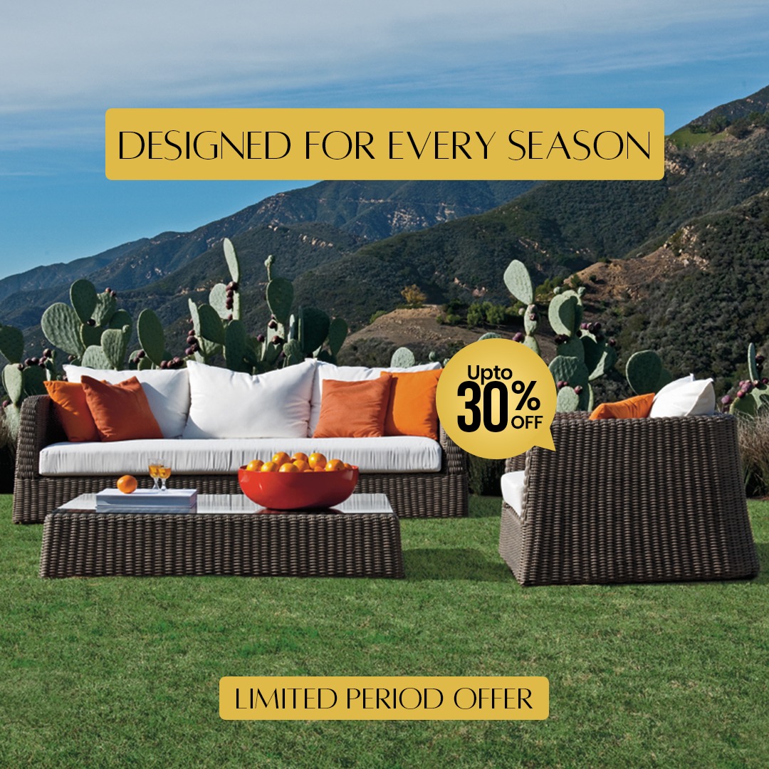 Loom Crafts Outdoor Garden Furniture A modern outdoor daybed with wicker detailing is positioned near the ocean shore on a wooden deck, accompanied by text overlay stating "LIFE TIME WARRANTY".